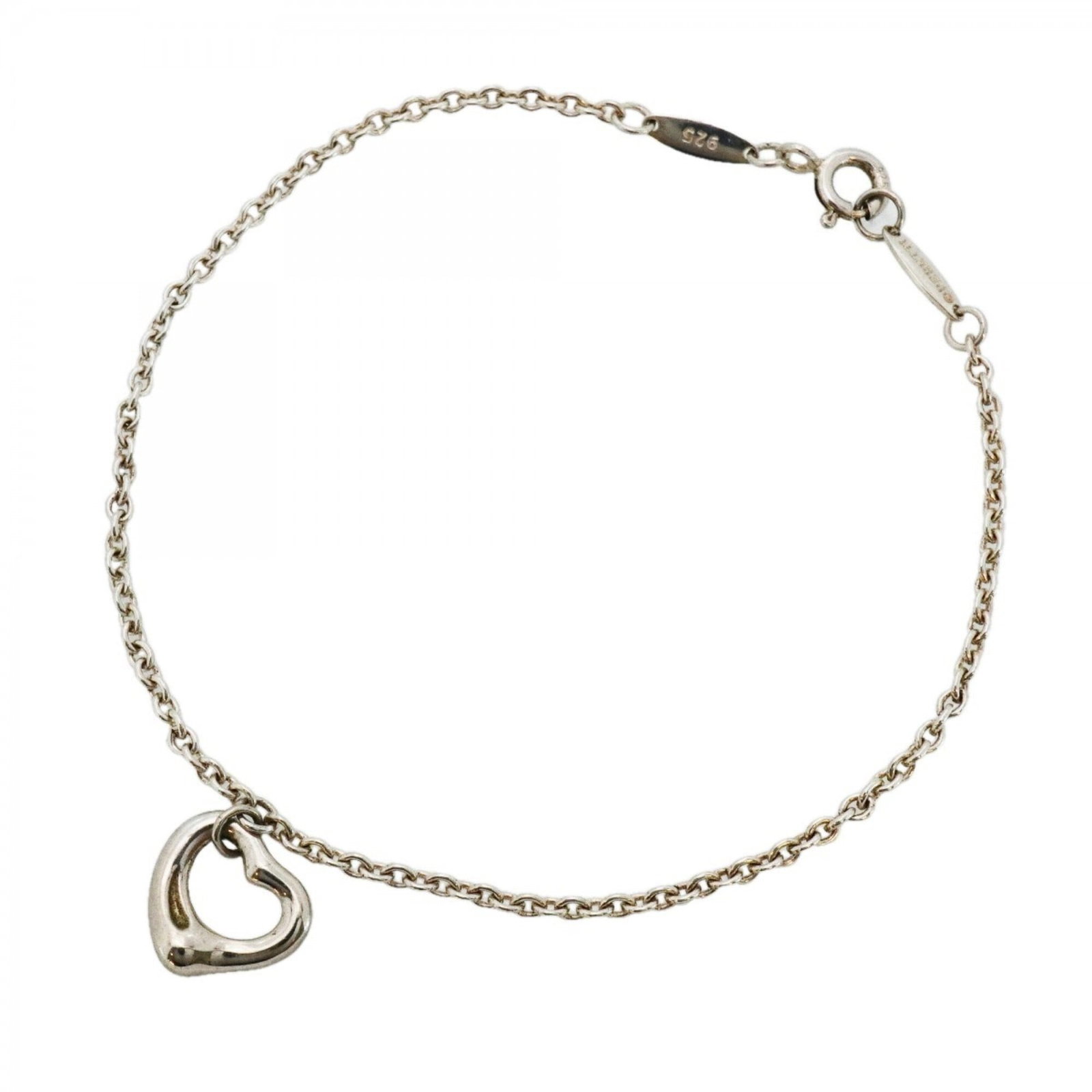Tiffany Charm Bracelet Silver 925: Tiffany Charm Bracelet Silver 925 Silver 925 Tiffany Charm Bracelet with Traces of Usage. This used charm bracelet features silver 925 material and has a length of 18cm. It shows signs of previous use