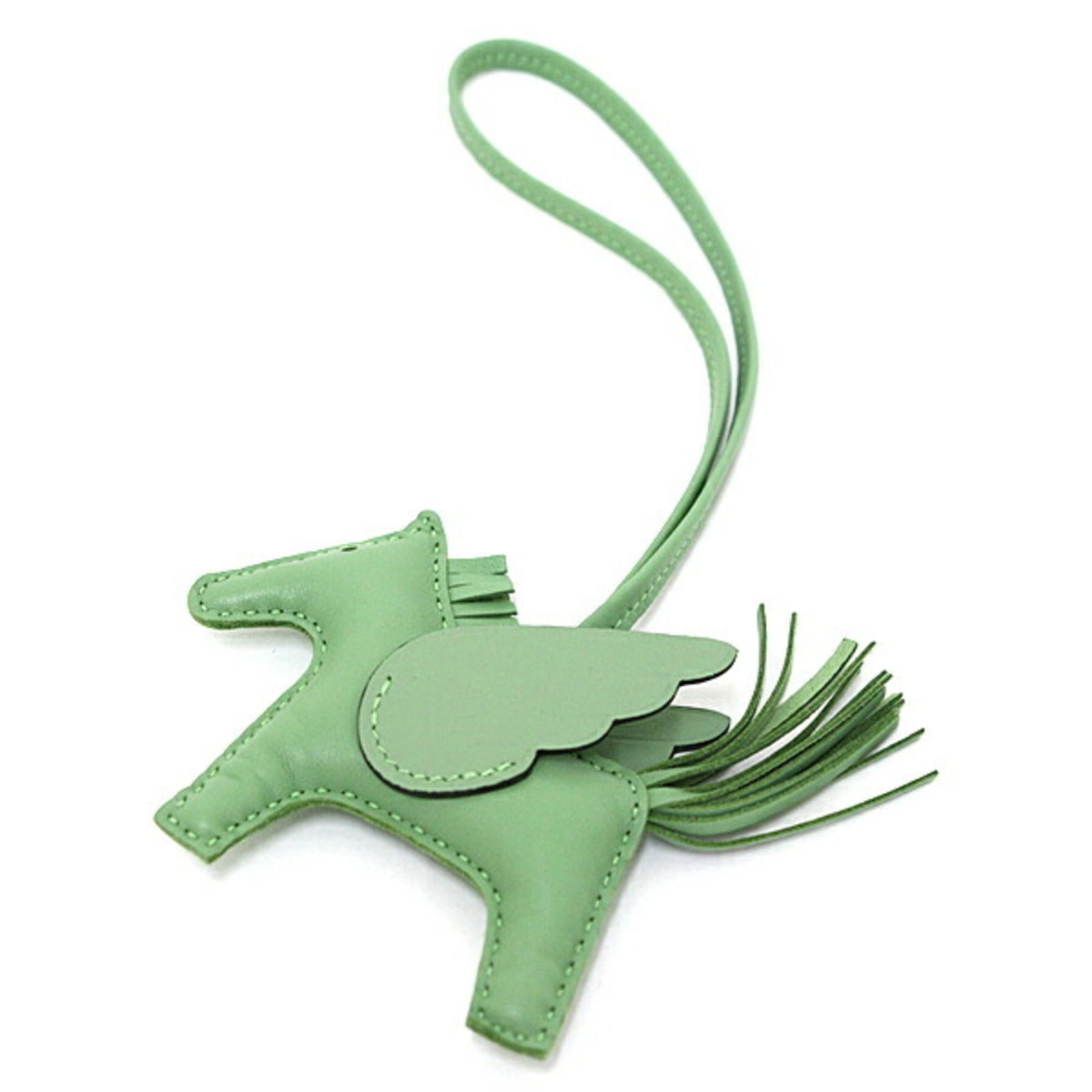 Hermes Handbag Charm Agneau Milo, Swift Leather: Hermes Handbag Charm Agneau Milo, Swift Leather Agneau Milo and Swift Leather come together in this unique Hermes Handbag Charm. The subtle green color adds a touch of elegance to any accessory, while