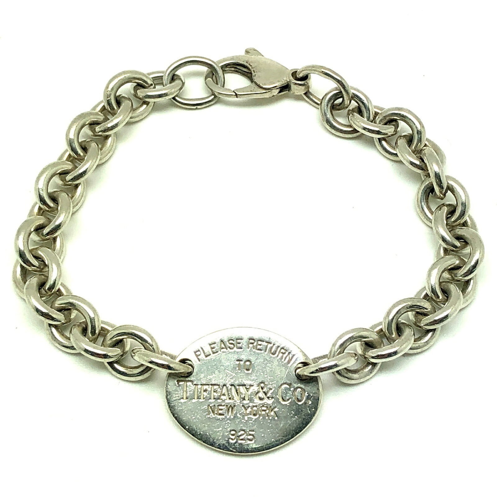 Tiffany Charm Bracelet Silver 925: Tiffany Charm Bracelet Silver 925 Silver 925 charm bracelet from Tiffany features a classic design with a silver metal construction. The 17cm length and 1.8cm width make it a versatile accessory for e