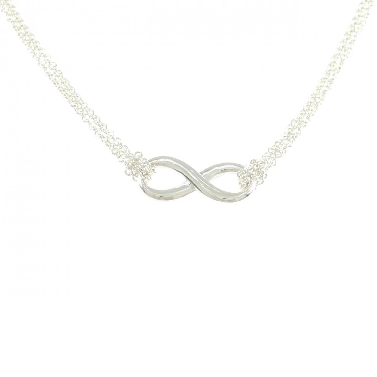 Tiffany Infinity Necklace: Tiffany Infinity Necklace The Tiffany Infinity Necklace boasts a striking silver design with an 8mm x 20mm pendant. With its 40 cm chain and 6.1g weight, this necklace offers a comfortable fit for