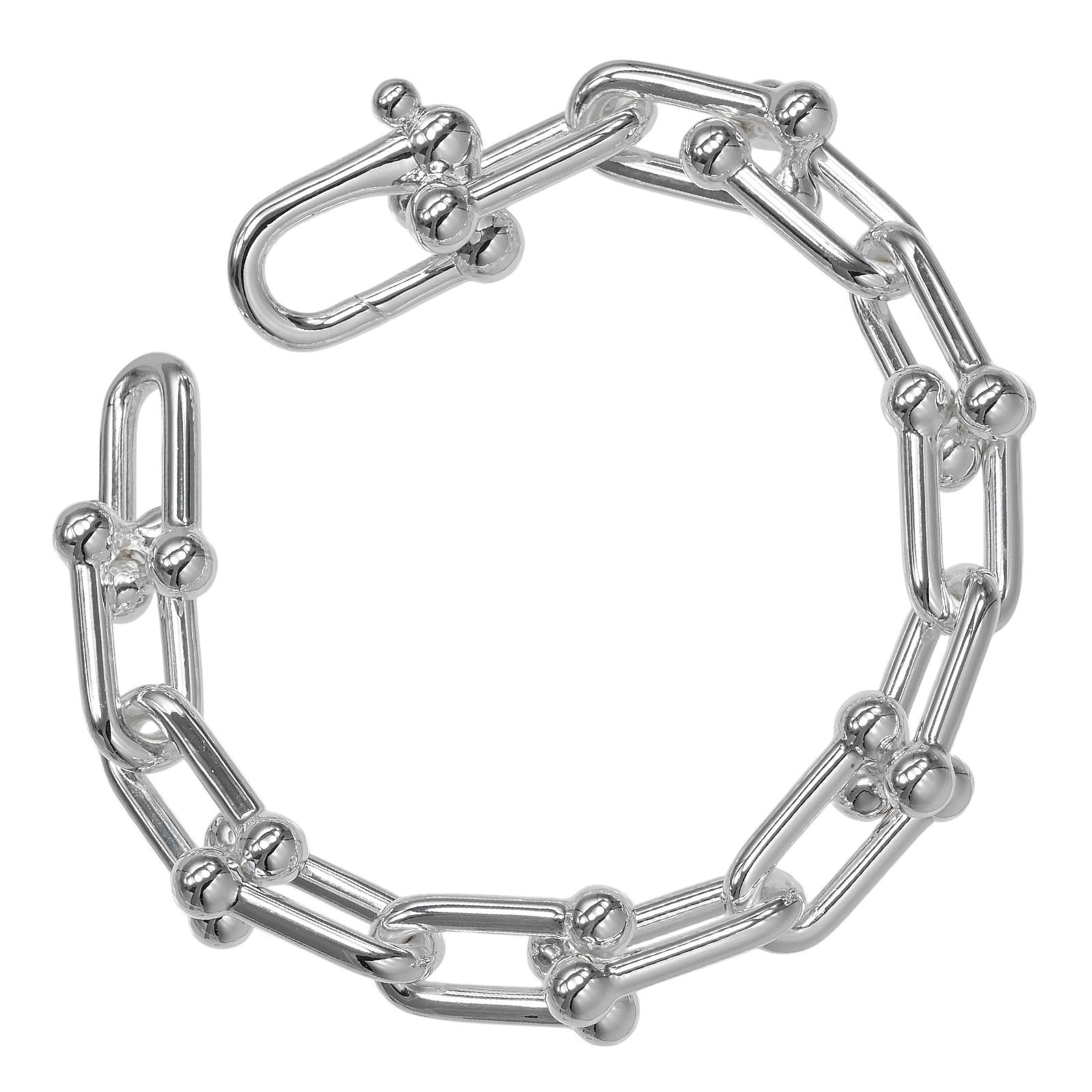 Tiffany Charm Bracelet Silver 925: Tiffany Charm Bracelet Silver 925 Silver 925 charm bracelet from Tiffany features a classic design with a few traces of usage, some scratches and dirt visible. Overall in very good condition, this use