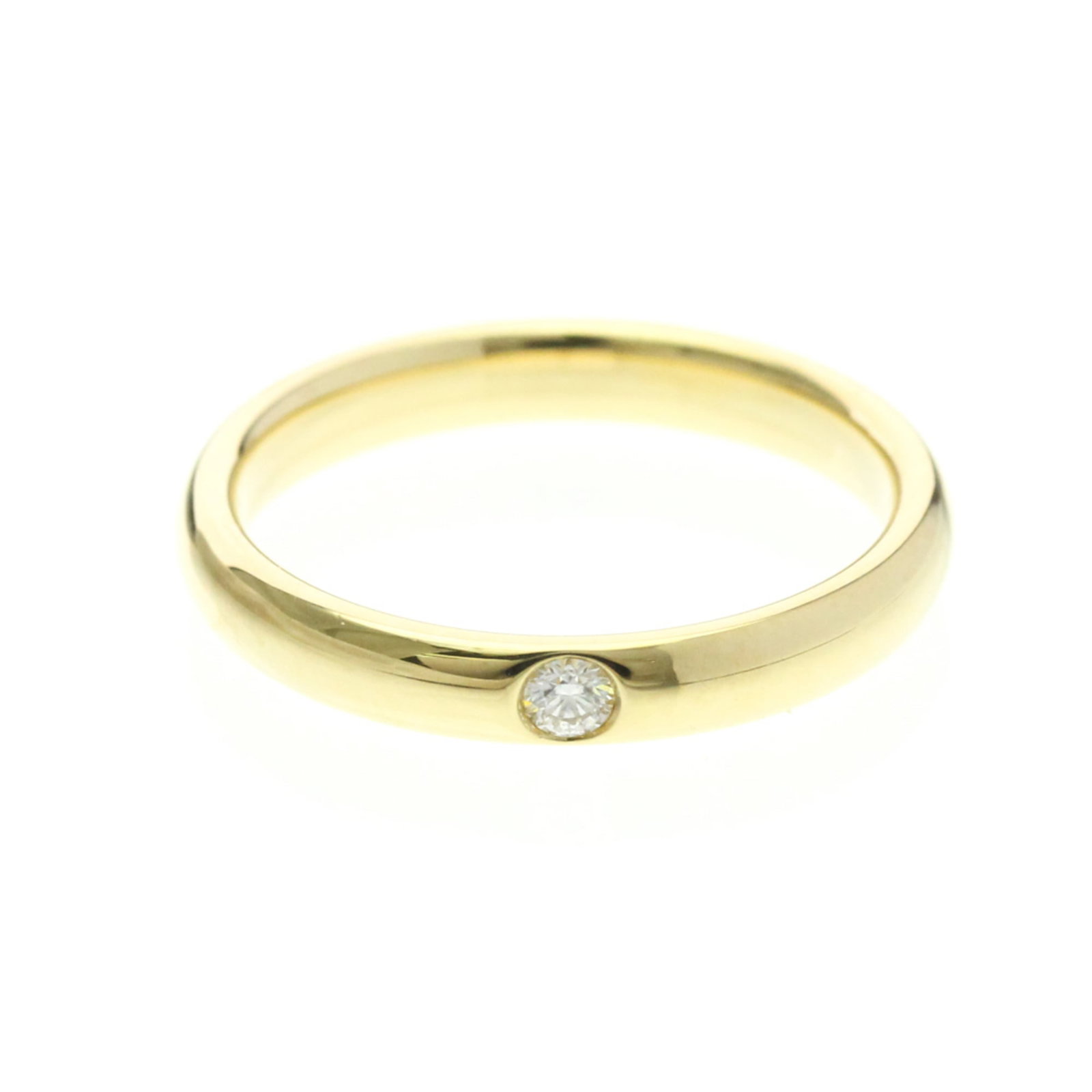 Harry Winston Band Ring Yellow Gold (18K): Harry Winston Band Ring Yellow Gold (18K) Yellow gold band ring from Harry Winston, featuring a diamond stone and 18K metal construction. With its sleek design and subtle sparkle, this piece adds a to