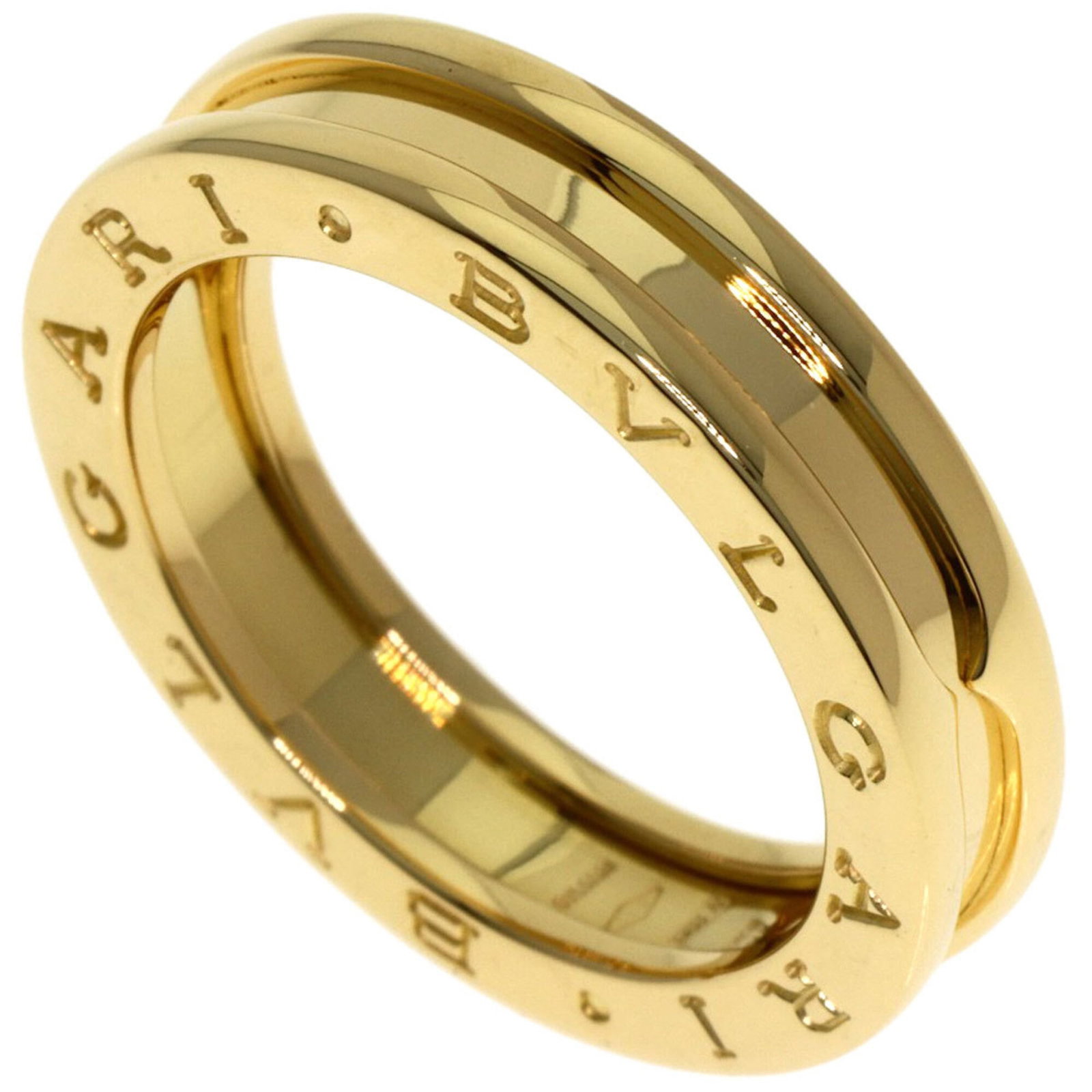 Bvlgari Band Ring Yellow Gold (18K): Bvlgari Band Ring Yellow Gold (18K) Yellow gold 18K Bvlgari band ring with a sleek design and classic style. This used ring features some scratches and dirt, but remains in very good condition overall
