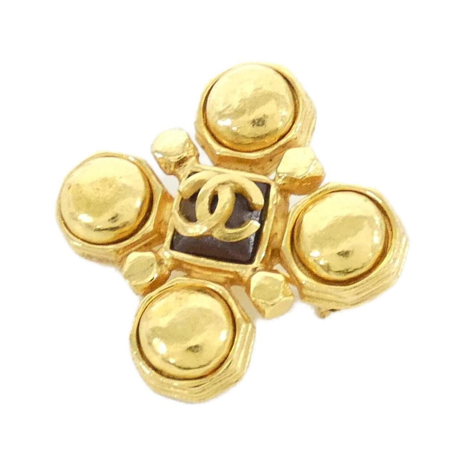 Chanel Brooch: Chanel Brooch This Chanel brooch boasts a timeless design with a rich brown and gold finish. Measuring 4.3cm x 4.2cm, its compact size belies its elegant presence. With a few subtle signs of wear,