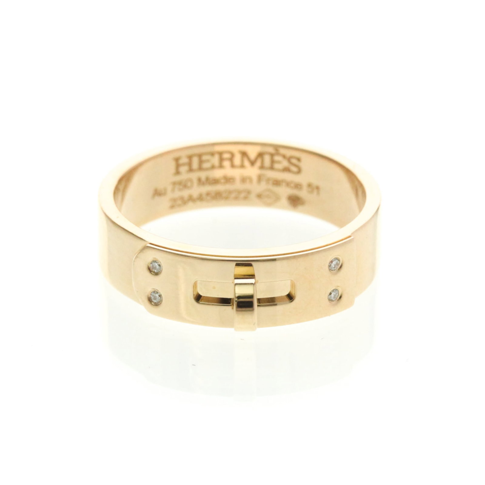 Hermes Band Ring Pink Gold (18K): Hermes Band Ring Pink Gold (18K) Pink Gold (18K) band ring from Hermes features a delicate design with a subtle pink hue. This fashion ring boasts a diamond stone and measures 5mm in width, weighing 5