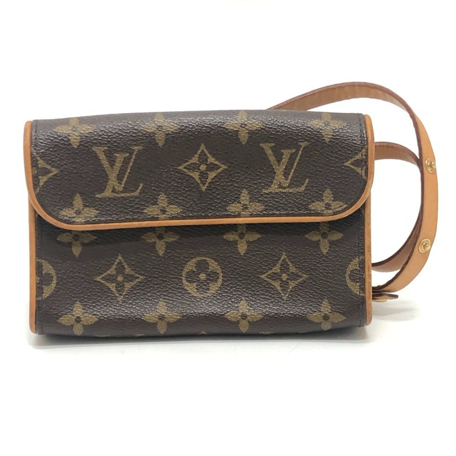Louis Vuitton Fanny Pack Pochette Monogram: Louis Vuitton Fanny Pack Pochette Monogram This Louis Vuitton Fanny Pack Pochette Monogram in brown features the iconic monogram pattern and a convenient magnet closure. Measuring 10.5cm x 16.5cm x