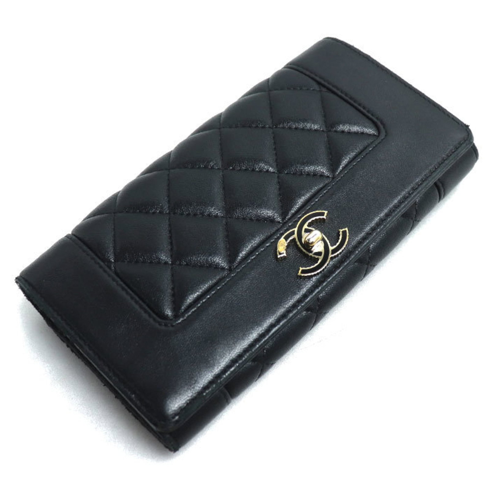 Chanel Long Wallet (Bi-Fold) Leather: Chanel Long Wallet (Bi-Fold) Leather The Chanel Long Wallet (Bi-Fold) Leather features a sleek black lambskin exterior with a snap fastener closure and multiple inner pockets for organization. This ve