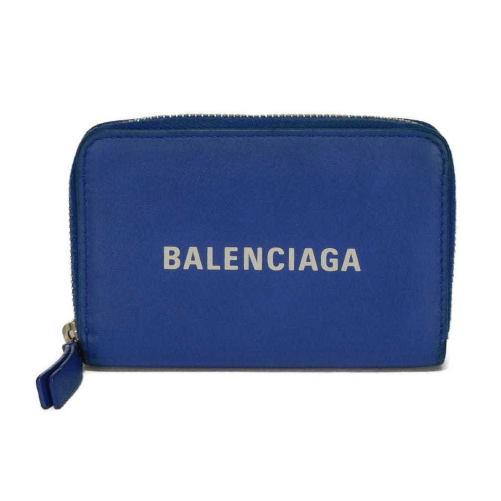 Balenciaga Coin Purse/Coin Case Leather: Balenciaga Coin Purse/Coin Case Leather Smooth Calf Leather Balenciaga Coin Purse/Coin Case in Blue features a classic design with clean lines and minimal ornamentation. The item measures 7.5cm x