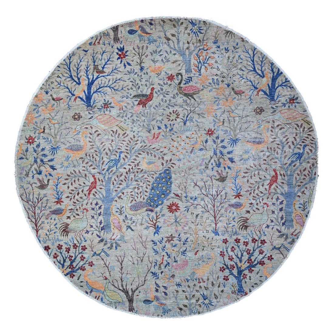 Hand knotted round rug made from peshawar wool in tempered gray color: Hand knotted round rug made from peshawar wool in tempered gray color Tempered gray in every subtle shade, this hand-knotted round rug from Peshawar wool boasts an authentic Afghan design. Made with t