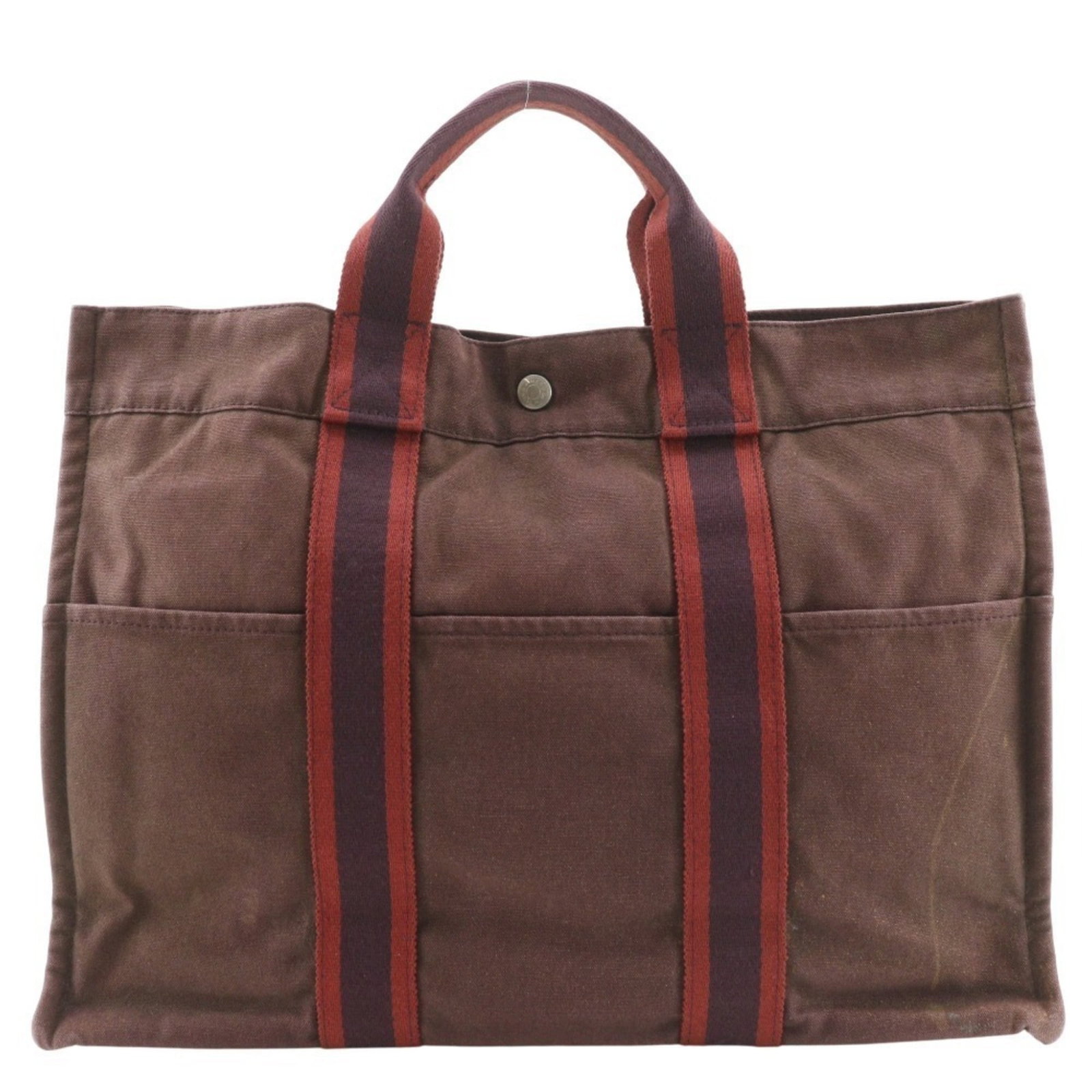 Hermes Handbag Cotton Canvas: Hermes Handbag Cotton Canvas Cotton canvas construction gives this Hermes handbag its unique texture and durability. With its brown color and classic design, it's a timeless piece that can add a touch