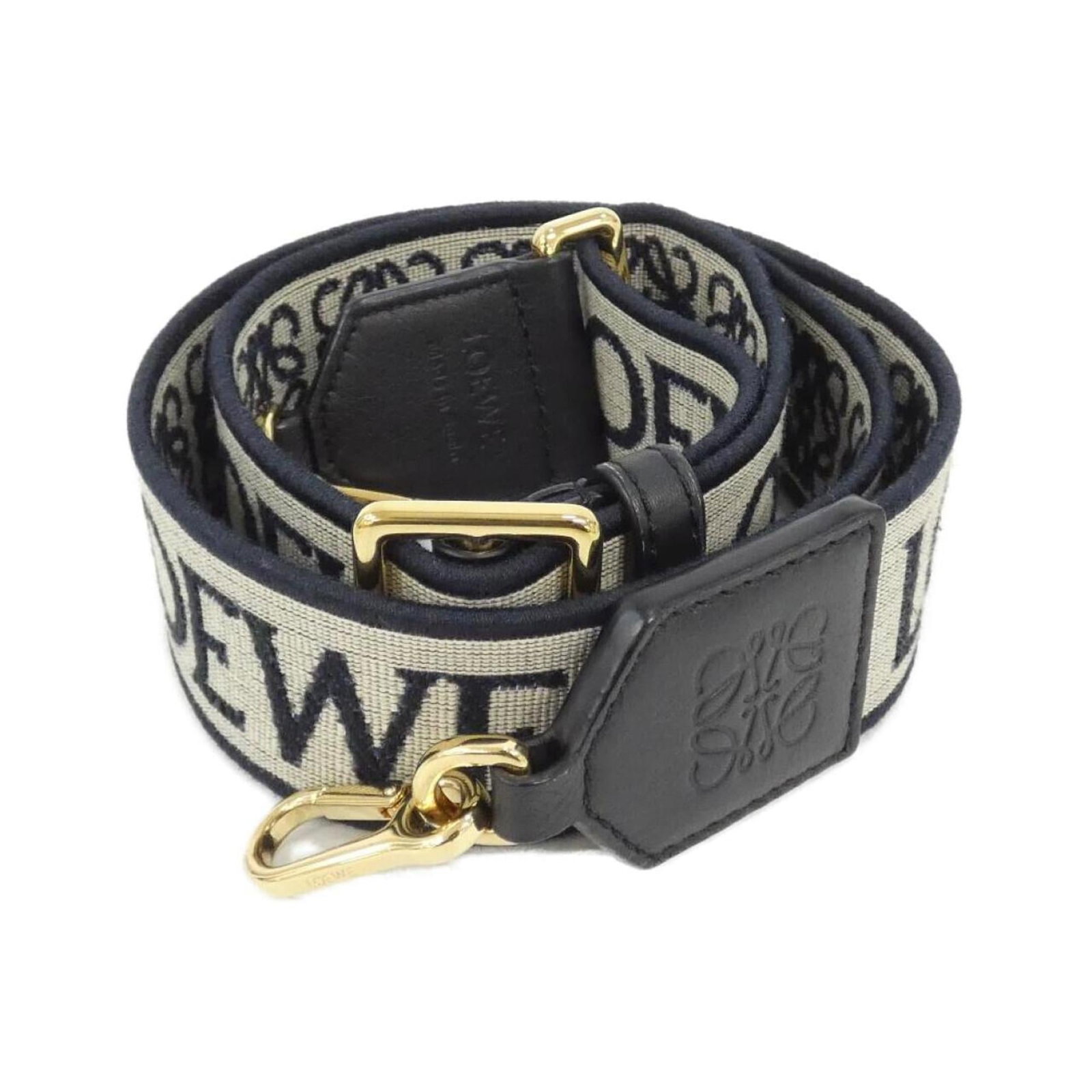 Loewe Strap Canvas Leather: Loewe Strap Canvas Leather Canvas and leather strap from Loewe in black and navy, featuring a classic design with a few traces of usage visible. The item has some scratches and dirt but remains in ver