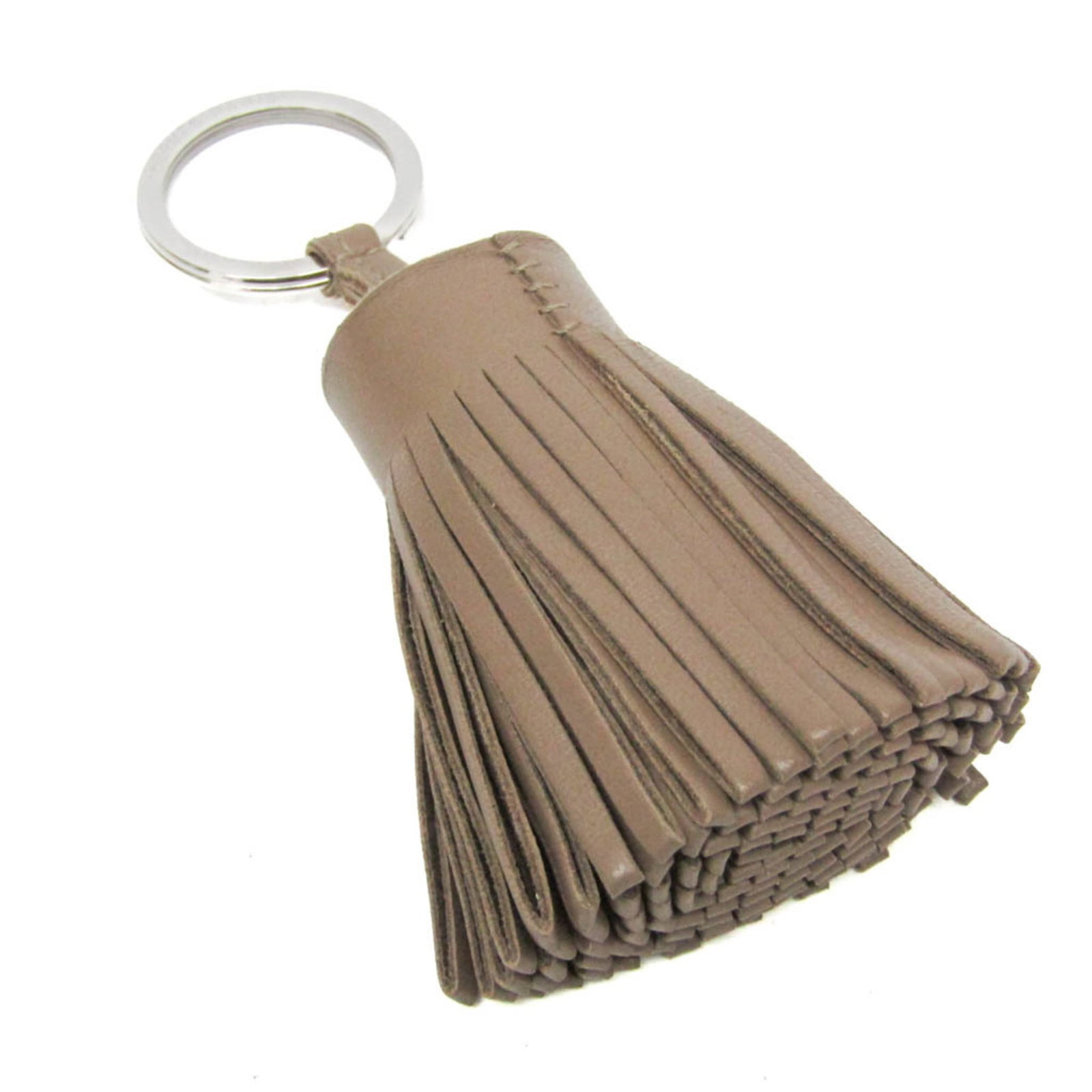 Hermes Keyring Agneau Milo: Hermes Keyring Agneau Milo The Hermes Keyring Agneau Milo boasts an elegant beige hue and intricate design, showcasing the luxurious Agneau Milo material. Its compact size makes it a stylish