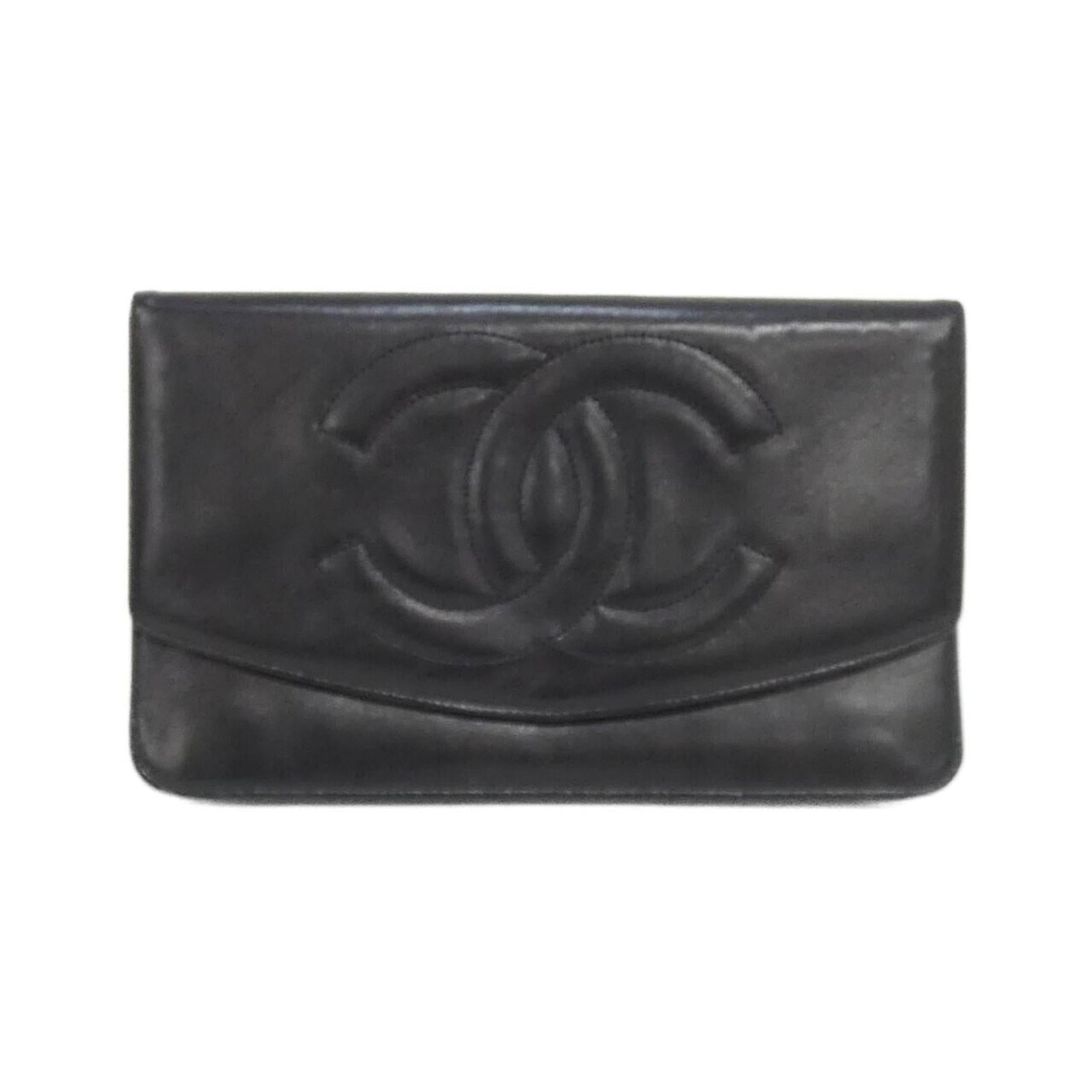 Chanel Long Wallet (Bi-Fold) Leather: Chanel Long Wallet (Bi-Fold) Leather The Chanel Long Wallet (Bi-Fold) Leather features a timeless design with a lambskin finish in black. With its classic bi-fold layout and spacious interior, this lo