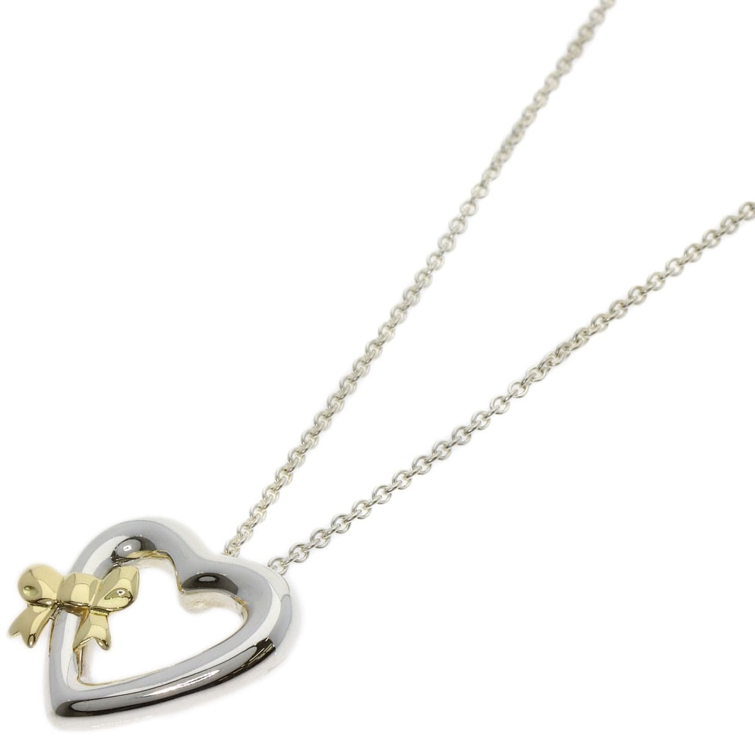Heart Ribbon Necklace Tiffany&Co Silver 18K Yellow Gold: Heart Ribbon Necklace Tiffany&Co Silver 18K Yellow Gold Tiffany&Co's silver 18K yellow gold necklace boasts a sleek design with no main stone. The 18.1-inch length makes it a versatile accessory for