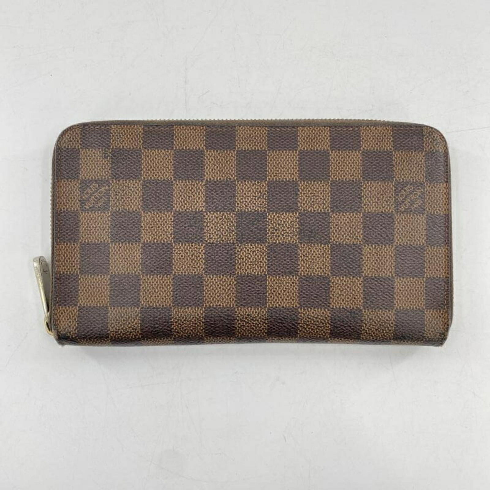 Louis Vuitton Long Wallet (Bi-Fold): Louis Vuitton Long Wallet (Bi-Fold) Brown Louis Vuitton Long Wallet (Bi-Fold) - A timeless accessory with a rich history. This bi-fold wallet features the iconic monogram pattern and measures 11.5cm x