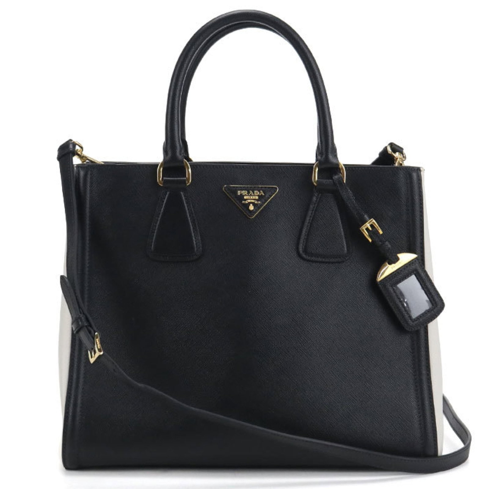 Prada Tote Bag Leather: Prada Tote Bag Leather Used Prada Tote Bag in black leather with a classic design. The bag has some scratches and dirt, but overall remains in very good condition. Its timeless style makes it a versat