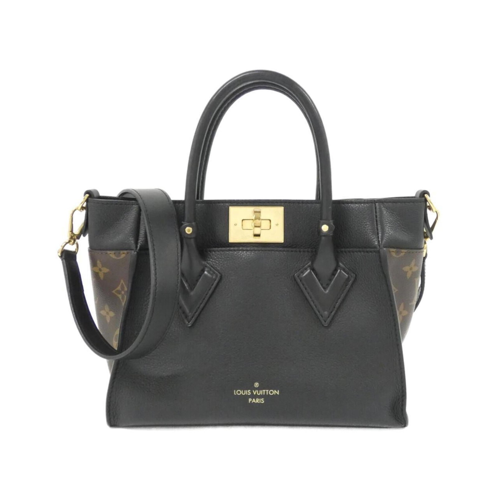 Louis Vuitton Handbag Coated Canvas Leather: Louis Vuitton Handbag Coated Canvas Leather Coated canvas leather and calf leather come together in this sleek Louis Vuitton handbag. Measuring 20cm x 25cm x 12cm, its gold hardware adds a touch of so