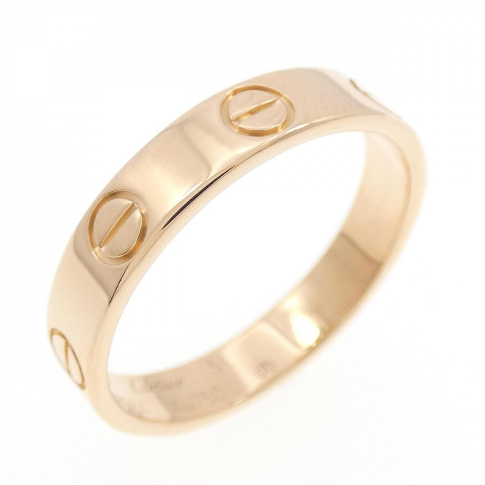 Cartier Band Ring Pink Gold (18K): Cartier Band Ring Pink Gold (18K) Cartier Band Ring in Pink Gold (18K) boasts elegant design with subtle scratches and dirt, giving it a well-worn look. The pink gold material adds a touch of sophisti