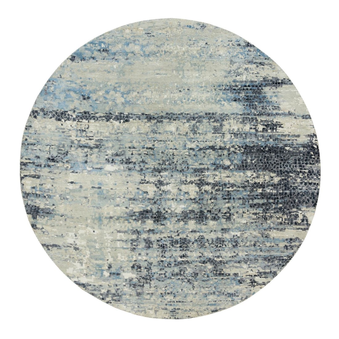 Modern round rug gray wool silk castlerock hand knotted 8x8 design: Modern round rug gray wool silk castlerock hand knotted 8x8 design Modern round rug with an 8x8 hand-knotted design in gray wool silk. The intricate pattern features regional Indian designs, adding a 