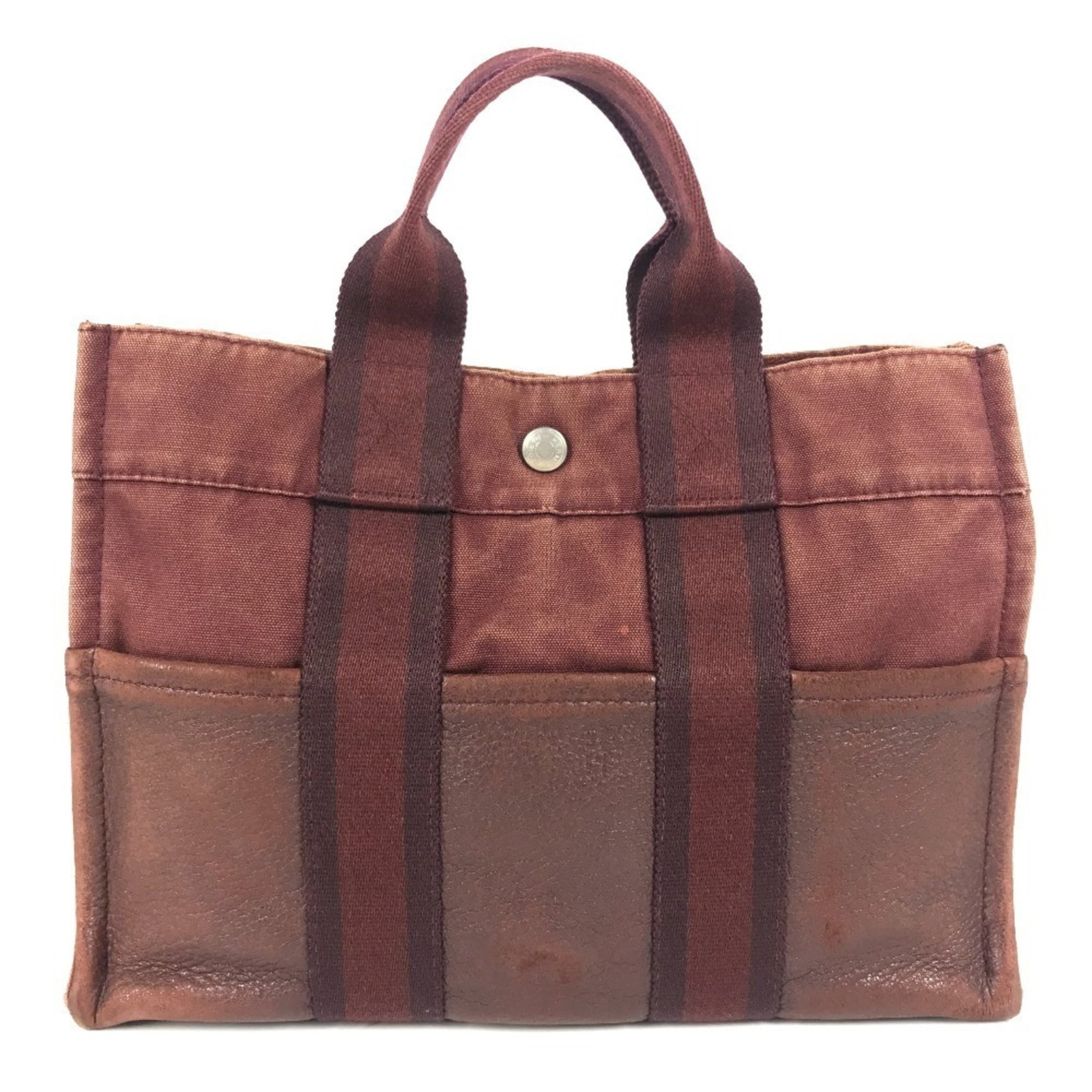 Hermes Handbag Tote Bag Canvas Leather: Hermes Handbag Tote Bag Canvas Leather This vibrant red Hermes handbag tote bag features a striking canvas and leather combination. With its classic design and timeless color, this stylish accessory i