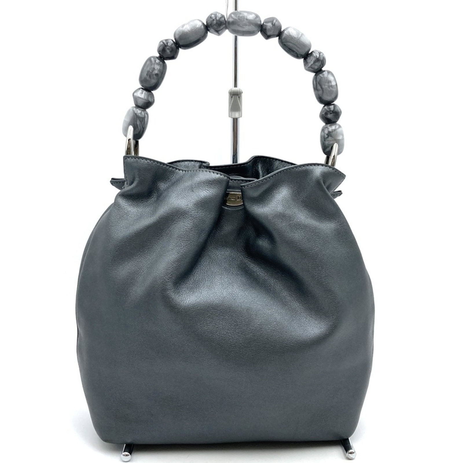 Christian Dior Handbag Leather: Christian Dior Handbag Leather This Christian Dior handbag features high-quality leather in a timeless gray color. The bag's classic design and durable material make it a practical choice for everyday