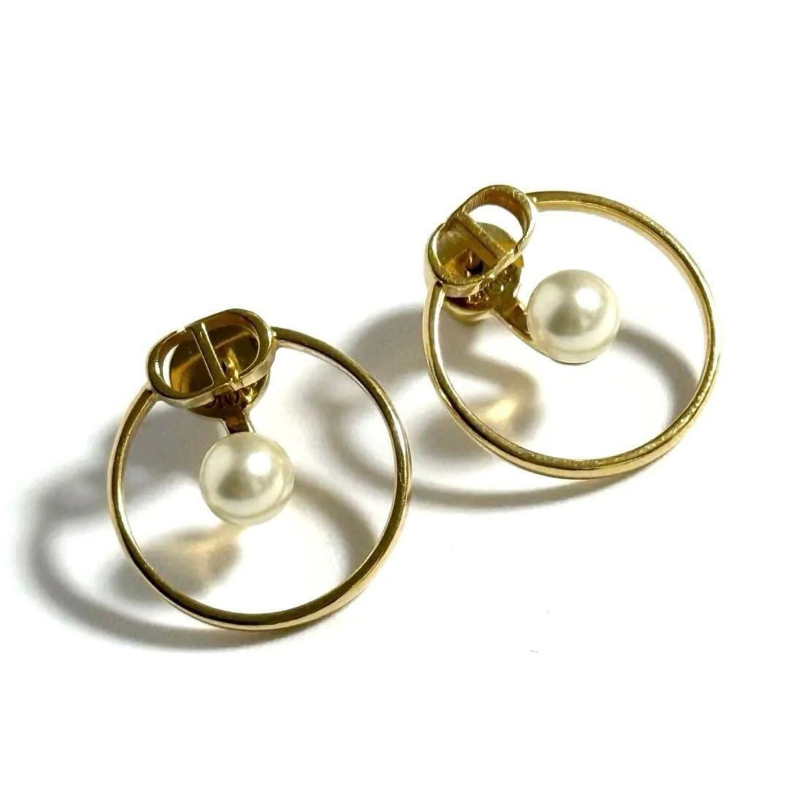 Christian Dior Stud Earrings Artificial Pearl Metal: Christian Dior Stud Earrings Artificial Pearl Metal Stud earrings featuring artificial pearl and metal construction in gold finish. The item shows some signs of usage, including scratches and minor di