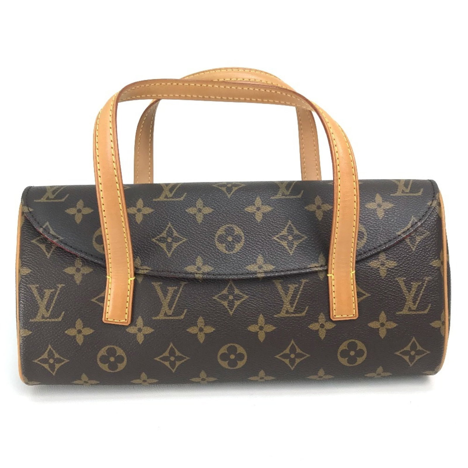 Louis Vuitton Handbag Monogram: Louis Vuitton Handbag Monogram Used Louis Vuitton Handbag Monogram in brown and red, featuring a classic magnet closure. The bag has some traces of usage with scratches and dirt, but remains in good c