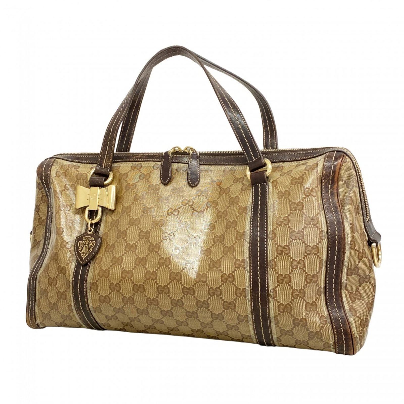 Gucci Tote Bag Coated Canvas: Gucci Tote Bag Coated Canvas The Gucci Tote Bag Coated Canvas features a timeless brown color and champagne gold hardware, adding a touch of sophistication to any outfit. Made from coated canvas mater