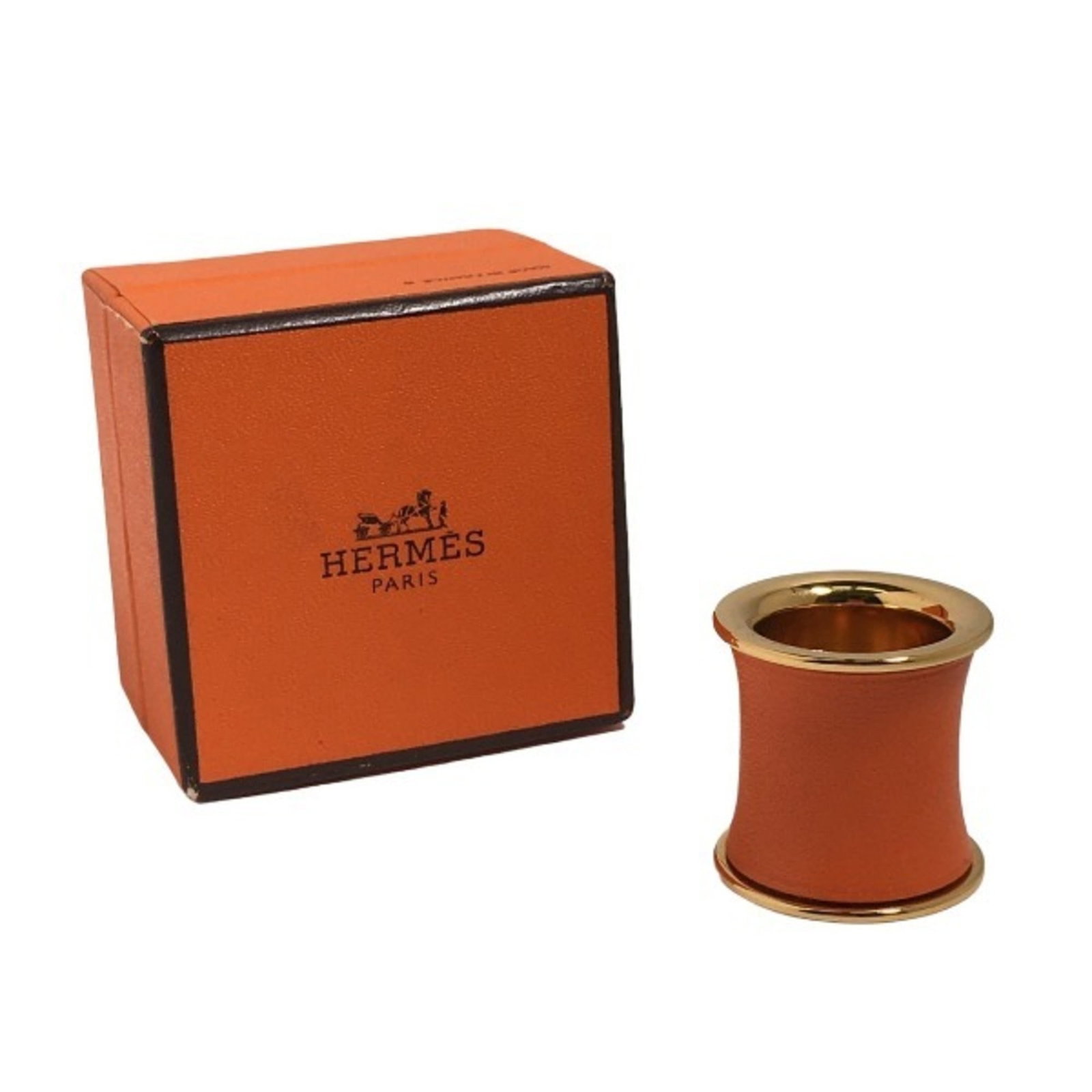 Hermes Scarf Ring: Hermes Scarf Ring The Hermes Scarf Ring boasts a vibrant orange hue and a unique design that showcases its signature style. With traces of usage visible, this ring has developed a subtle patina over t
