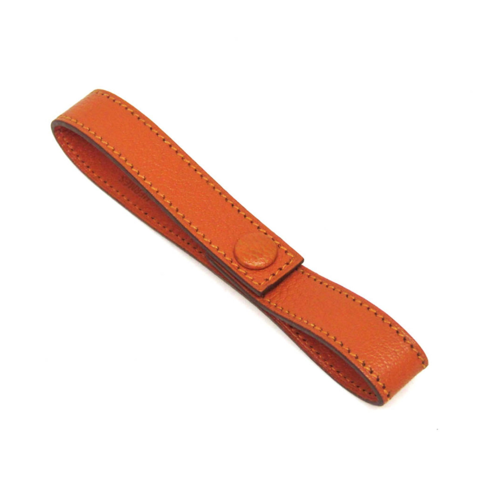 Hermes Glove Holder Leather: Hermes Glove Holder Leather This vibrant orange Hermes Glove Holder Leather is a unique accessory for those who appreciate stylish storage. Made from high-quality leather with a few traces of usage,