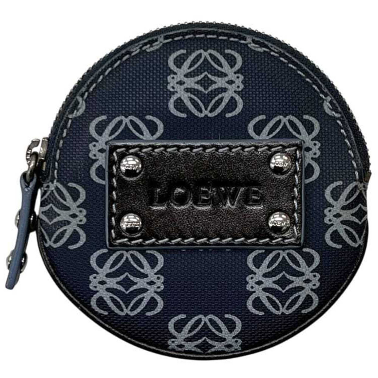 Loewe Coin Purse/Coin Case Pvc Leather: Loewe Coin Purse/Coin Case Pvc Leather Navy Loewe Coin Purse/Coin Case features pvc leather exterior with subtle scratches and traces of usage. Made from durable materials, this compact coin case meas