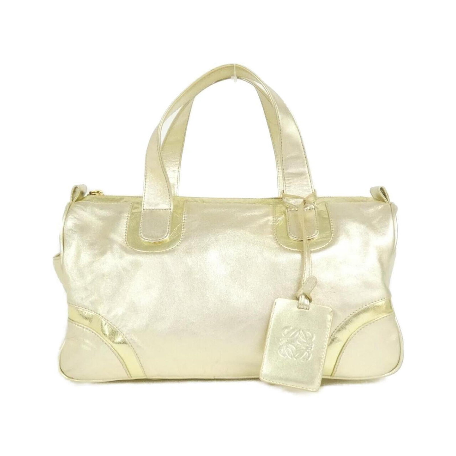 Loewe Handbag Leather: Loewe Handbag Leather This stunning Loewe handbag features rich gold leather with visible signs of use. With its classic design and elegant size, it's perfect for adding a touch of sophistication to a