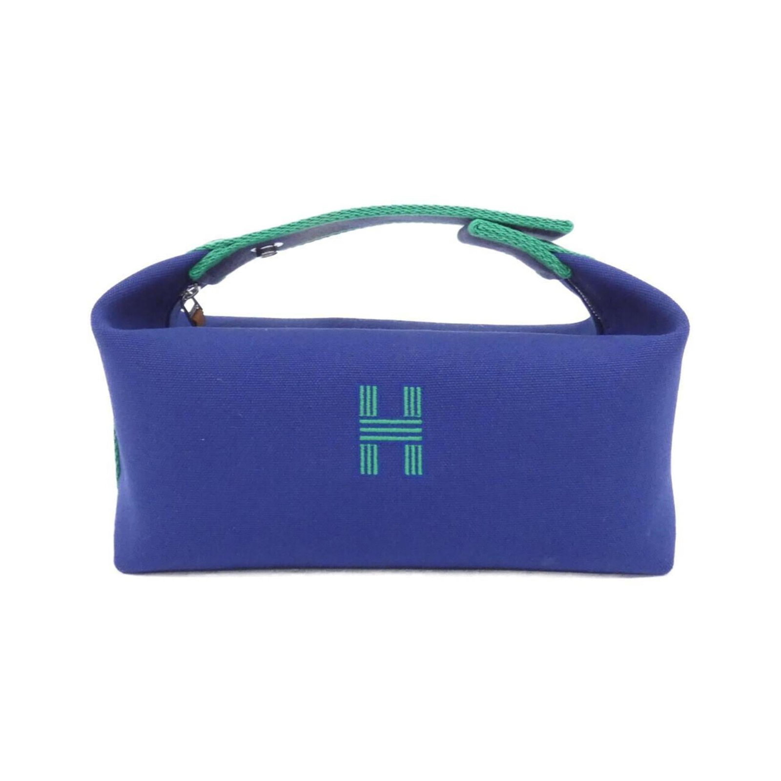 Hermes Handbag Pouch Canvas: Hermes Handbag Pouch Canvas Canvas pouch from iconic French fashion brand Hermes, featuring a striking blue hue and classic design. With its durable canvas material and compact size, this versatile ac