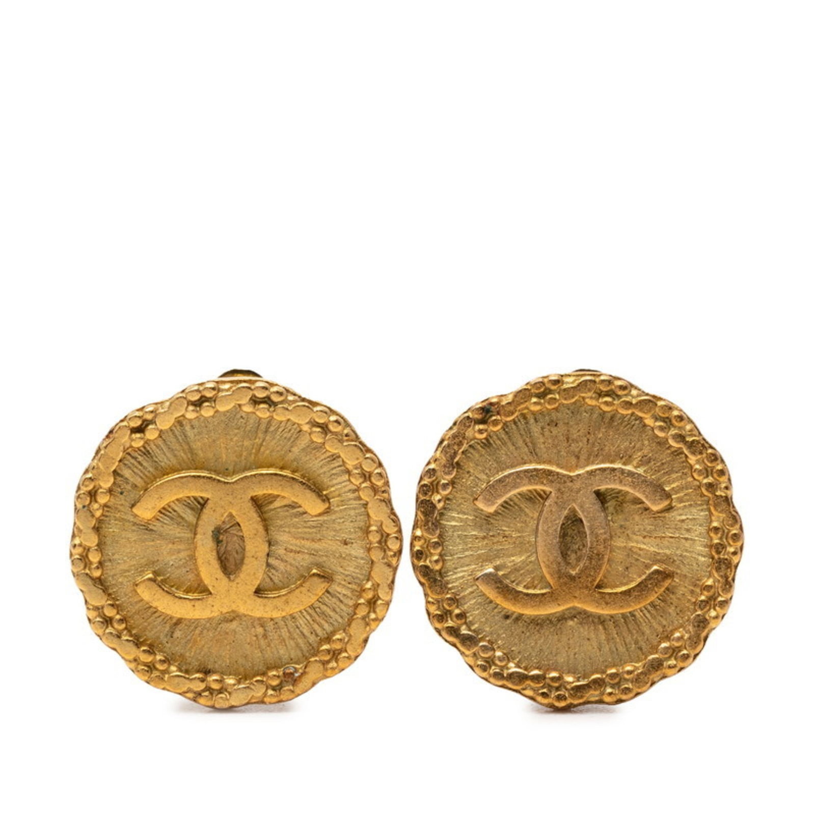 Chanel Clip Earrings: Chanel Clip Earrings Gold Chanel Clip Earrings with Traces of Usage. These clip earrings feature the iconic Chanel design and are made from gold. They show signs of previous use, including scratches a