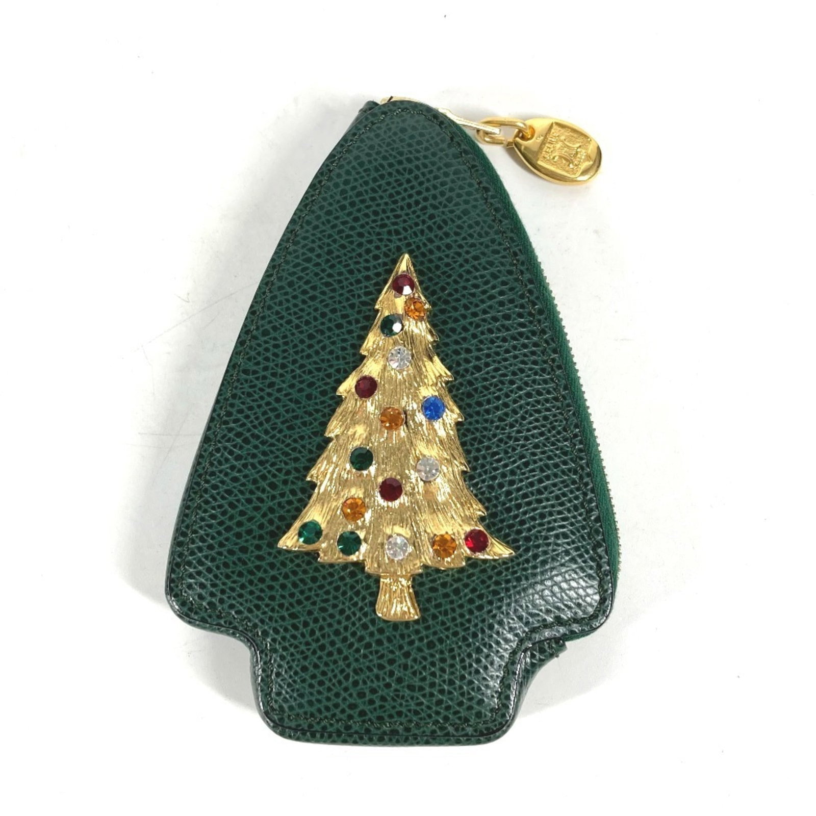 Celine Coin Purse/Coin Case Leather: Celine Coin Purse/Coin Case Leather This Celine Coin Purse/Coin Case Leather is a unique accessory featuring green leather with visible traces of usage and minor scratches. The compact size measures 1
