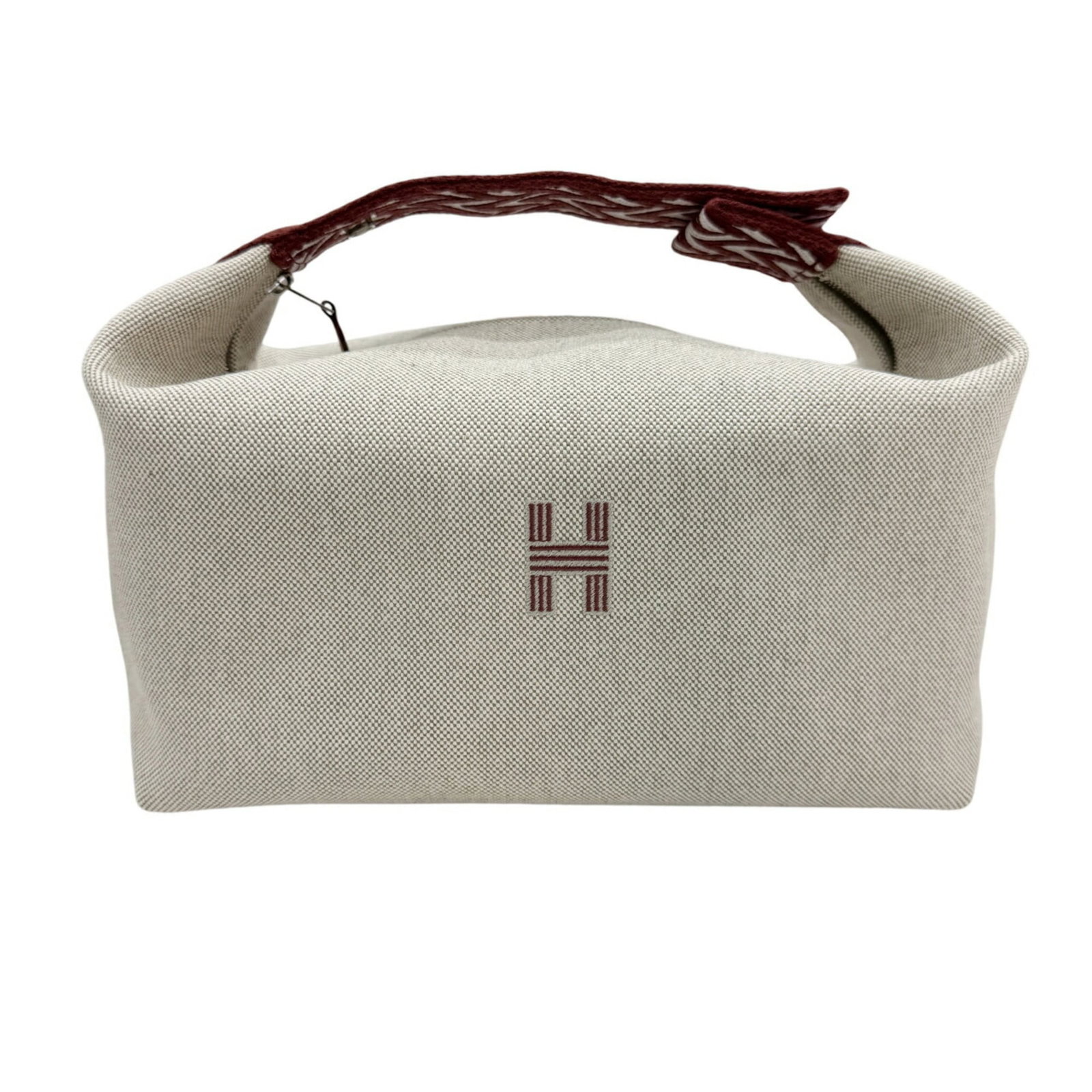 Hermes Handbag Pouch Toile H: Hermes Handbag Pouch Toile H Toile H pouch from iconic French fashion house Hermes, featuring natural and rouge h colors in an open condition. This compact, 14cm x 25cm x 15cm pouch showcases the bran