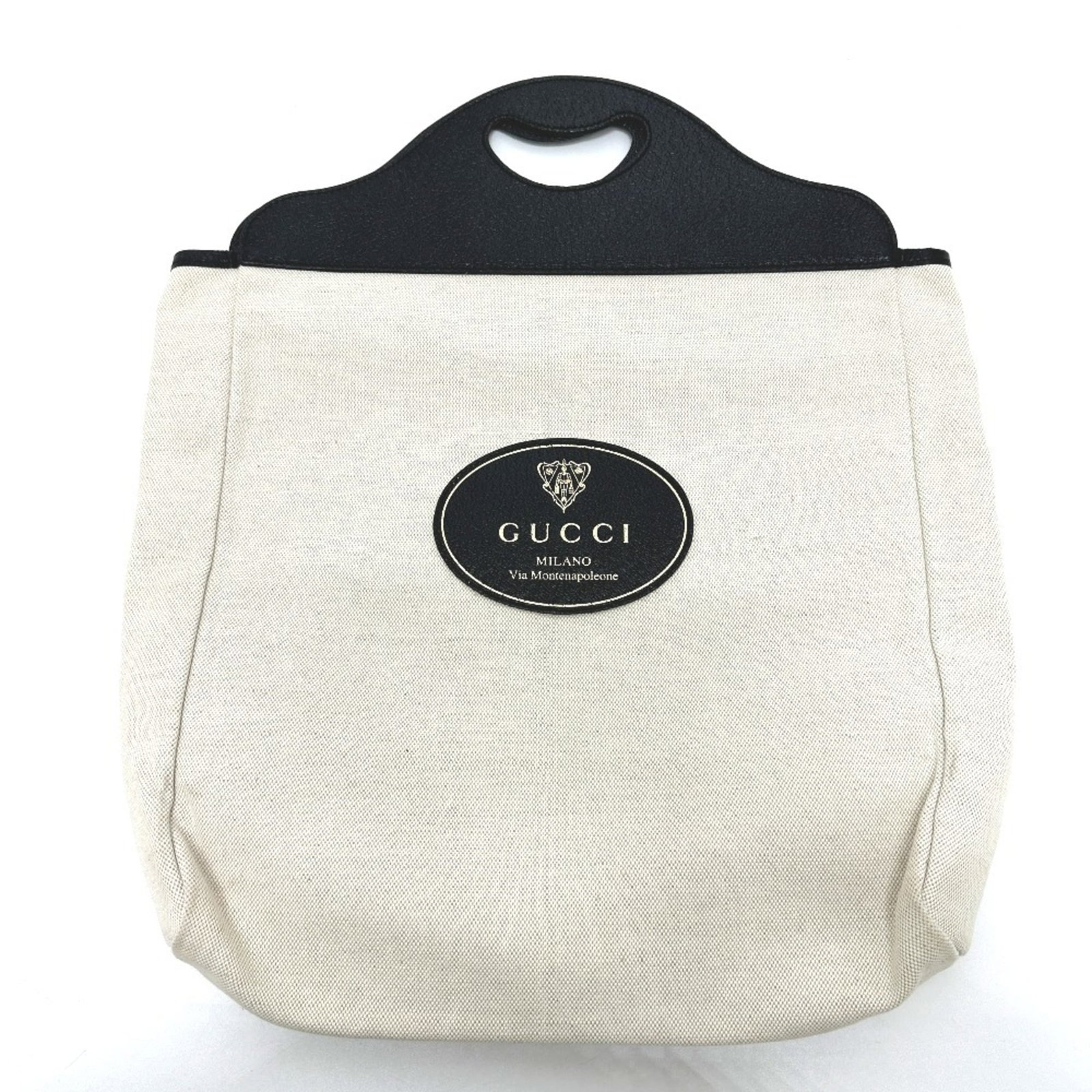 Gucci Handbag Canvas Leather: Gucci Handbag Canvas Leather Canvas and leather combine in this Gucci handbag, available in beige and black. The open closure and classic design make for a timeless accessory. Measuring 47cm x 12cm x
