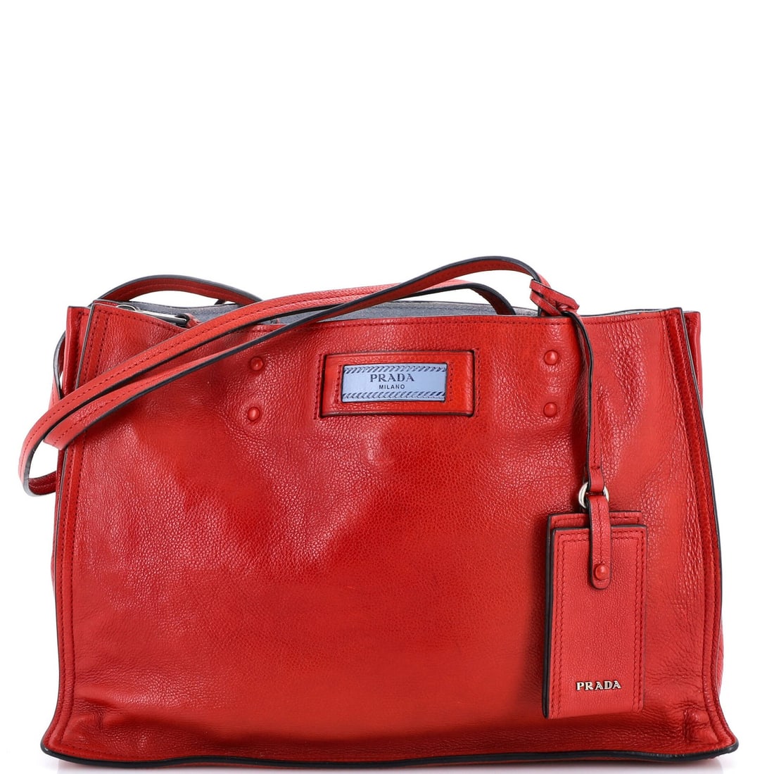 Calf Glace Prada Etiquette Tote Medium: Calf Glace Prada Etiquette Tote Medium The Prada Etiquette Tote Glace Calf Medium in red leather features a sleek and sophisticated design with heavy creases throughout its exterior. This medium-sized