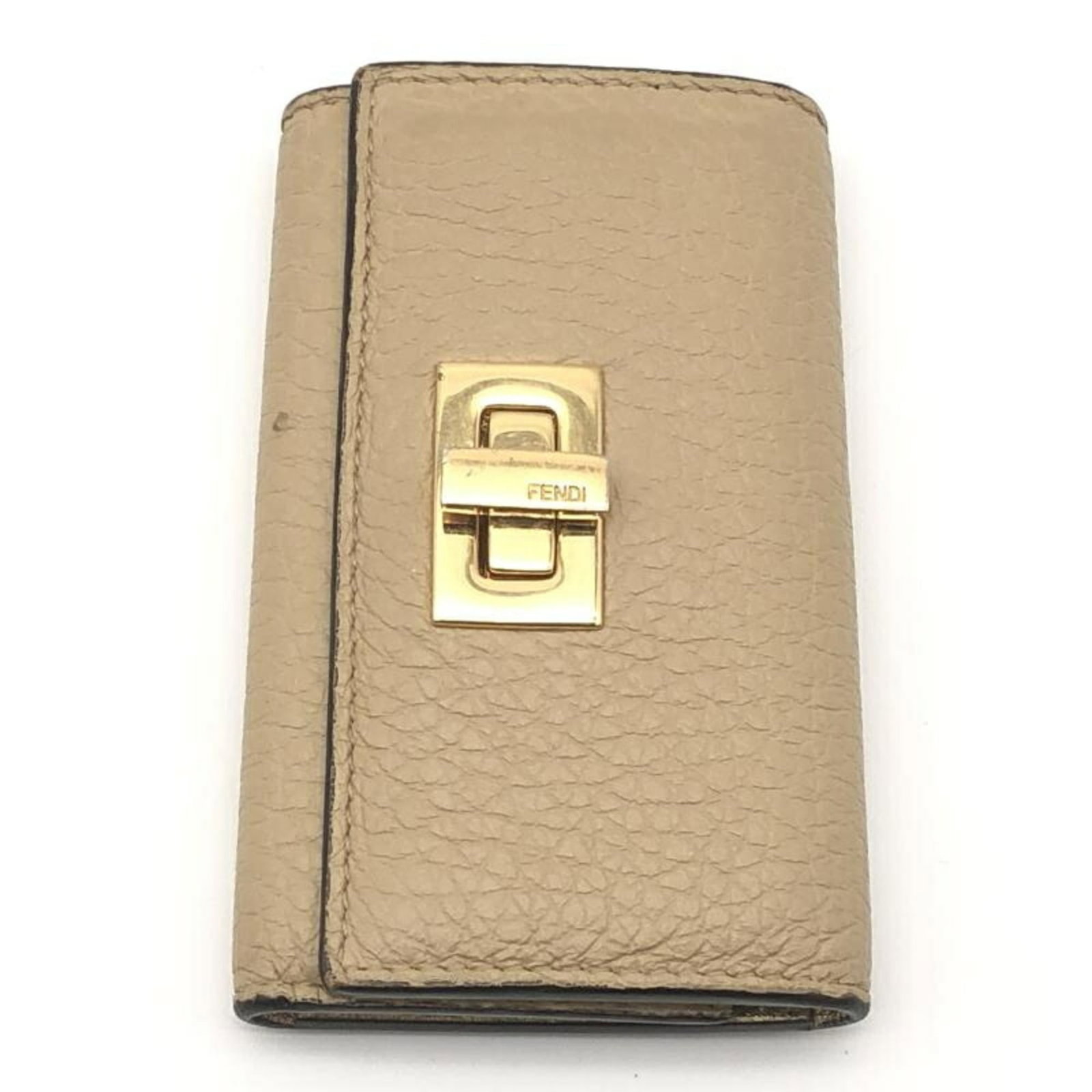 Fendi Keycase Leather: Fendi Keycase Leather Fendi Keycase Leather features high-quality calfskin material and a classic design. With its six key hooks and timeless beige color, this keycase is a practical and stylish acces