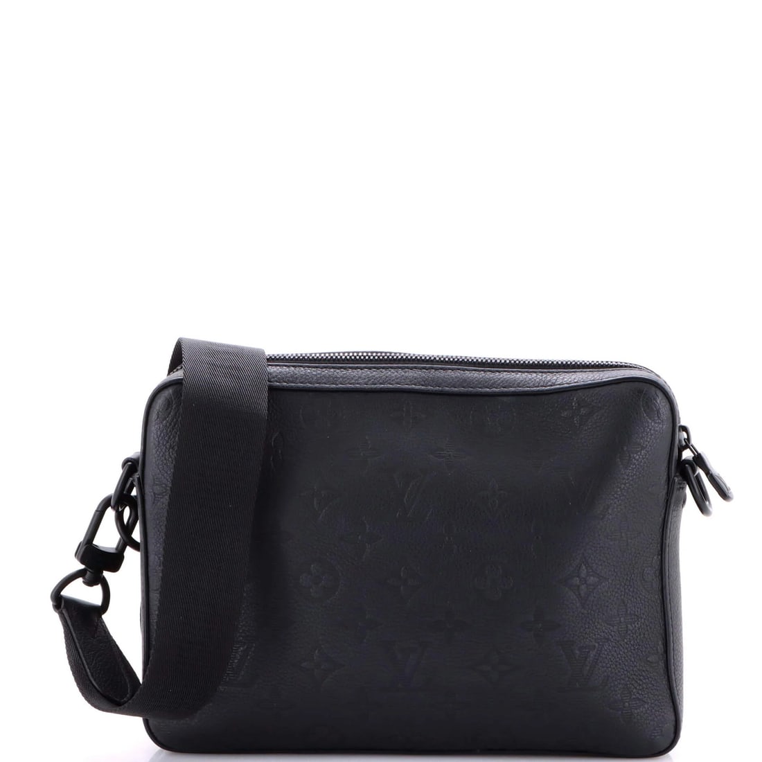 Trio messenger bag with monogram leather shadow: Trio messenger bag with monogram leather shadow Trio messenger bag with monogram leather shadow in black exterior, featuring minor corner wear and scuffs. The interior boasts a sleek black fabric lini