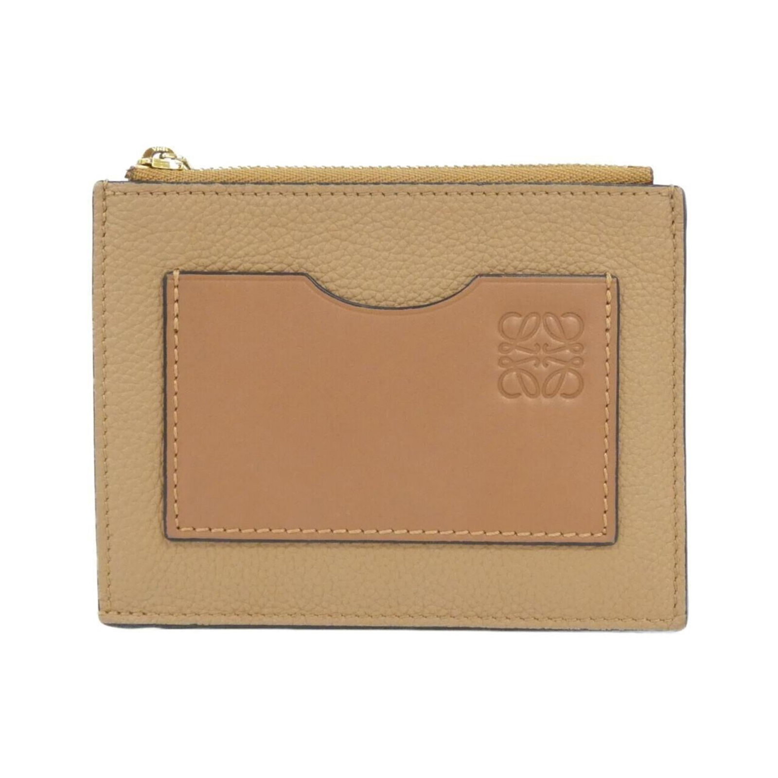 Loewe Coin Purse/Coin Case Leather: Loewe Coin Purse/Coin Case Leather This classic Loewe coin purse features rich brown calfskin leather and a timeless design. With its compact size and subtle scratches from previous use, this coin cas