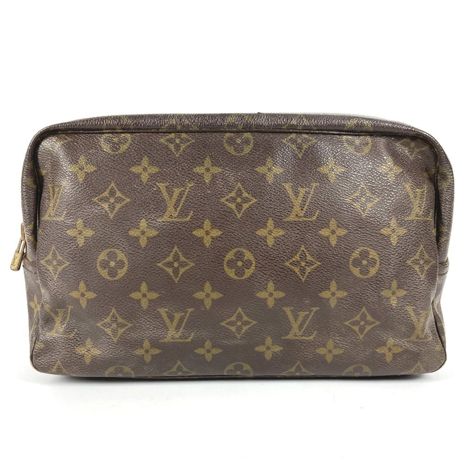 Louis Vuitton Clutch Bag Pouch Monogram: Louis Vuitton Clutch Bag Pouch Monogram The Louis Vuitton Clutch Bag Pouch Monogram in brown features the iconic monogram pattern, adding a touch of luxury to any outfit. With its compact size and