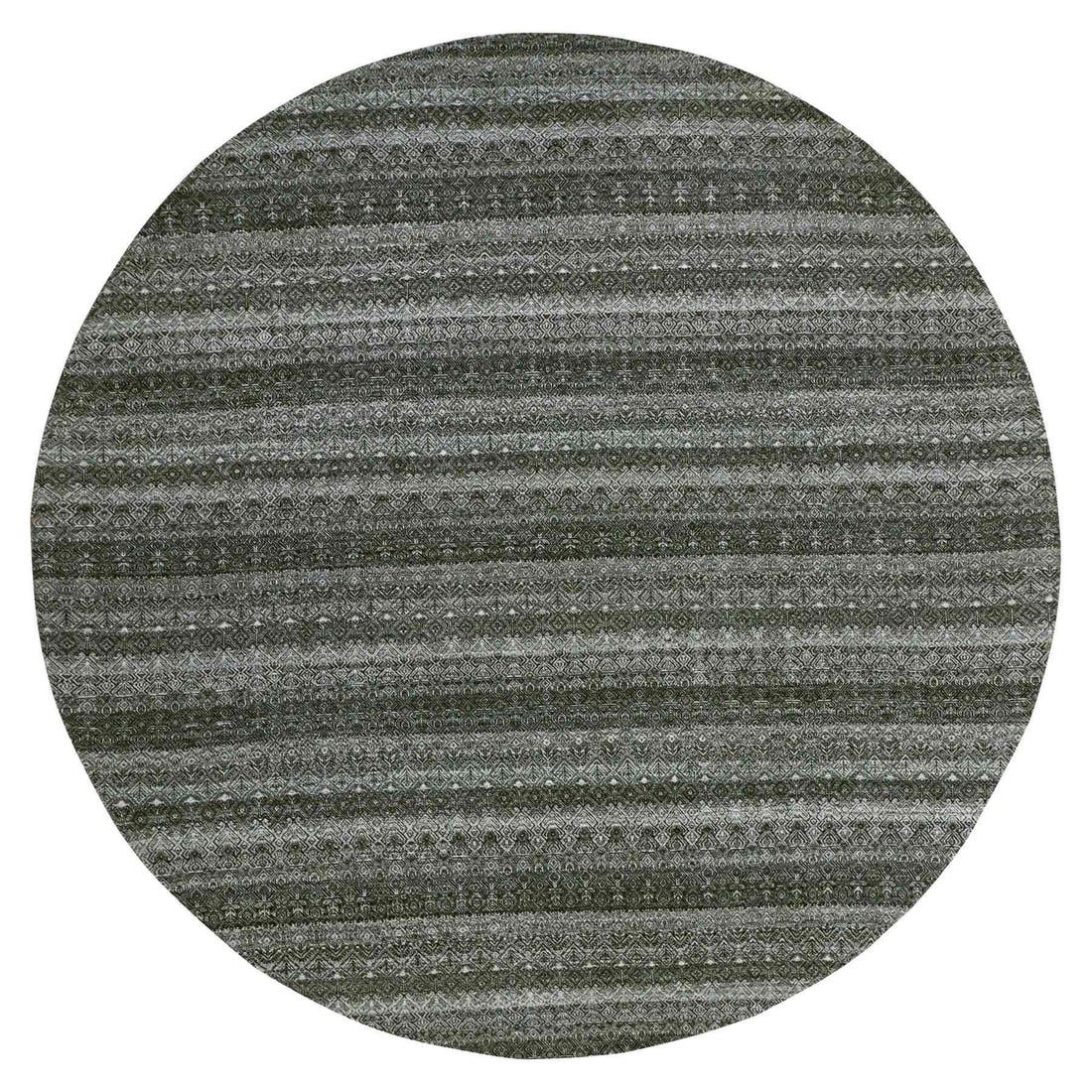 Hand knotted round rug graphite gray all wool kohinoor herrita: Hand knotted round rug graphite gray all wool kohinoor herrita The graphite gray Herrita round rug boasts a stunning all-wool design, expertly hand-knotted to create a unique and intricate pattern. Ma