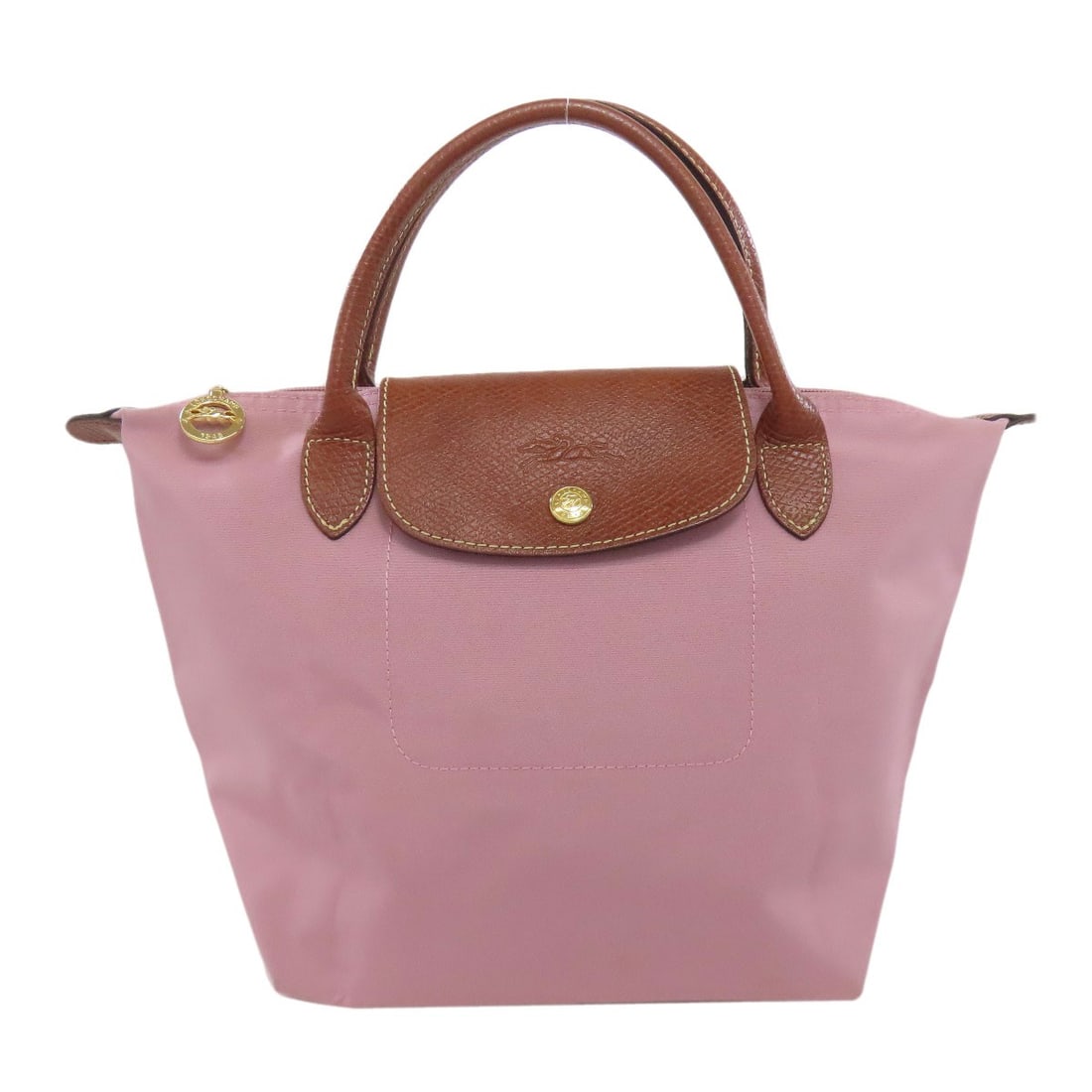 Nylon tote bag from Le Pliage: Nylon tote bag from Le Pliage Pink nylon tote bag from Le Pliage with a classic design. Made from high-quality nylon material, this iconic Longchamp style features a timeless exterior color. A versati