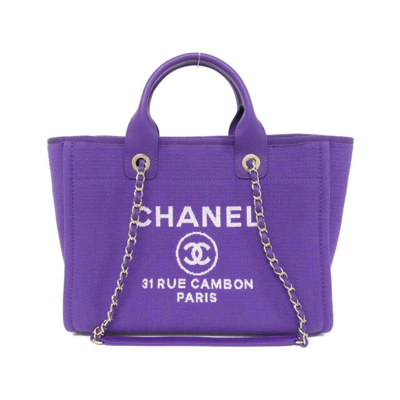 Chanel Handbag: Chanel Handbag Chanel's iconic handbag boasts a rich purple hue and gleaming gold hardware, adding a touch of sophistication to any outfit. Measuring 23cm x 39cm x 16cm, this stylish bag has been well