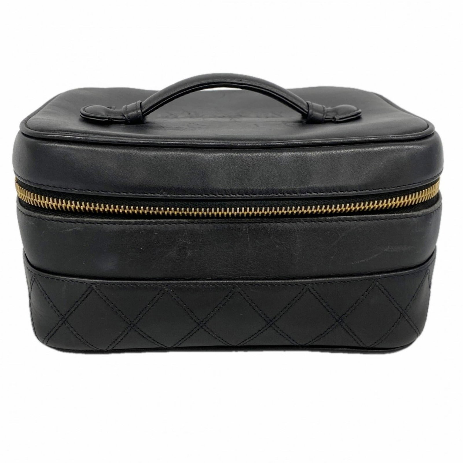 Chanel Handbag Vanity Bag Leather: Chanel Handbag Vanity Bag Leather Chanel's iconic Handbag Vanity Bag in luxurious lambskin leather boasts sleek black finish and gold hardware. This pre-owned beauty showcases subtle signs of wear, in