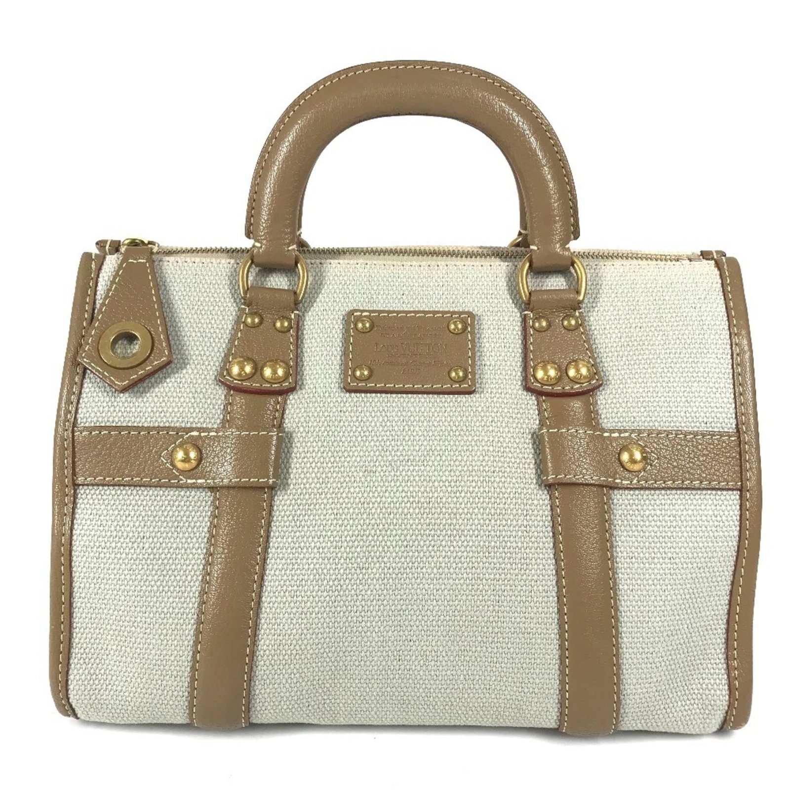 Louis Vuitton Handbag Tote Bag Leather Canvas: Louis Vuitton Handbag Tote Bag Leather Canvas Used Louis Vuitton Handbag Tote Bag in Beige Leather and Canvas, with visible traces of usage and minor scratches. The bag measures 21cm x 30cm x 17cm and