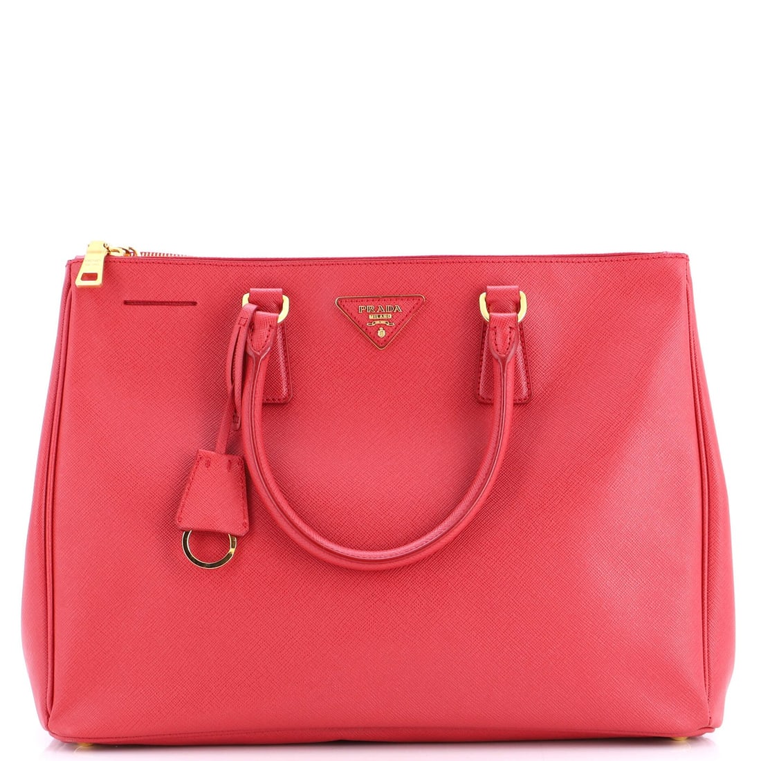 Double zip tote made from saffiano leather: Double zip tote made from saffiano leather Saffiano leather wraps around you in comfort and style with this vibrant red Double Zip Lux Tote. Measuring 10.5" tall and 14" wide, the spacious interior fe