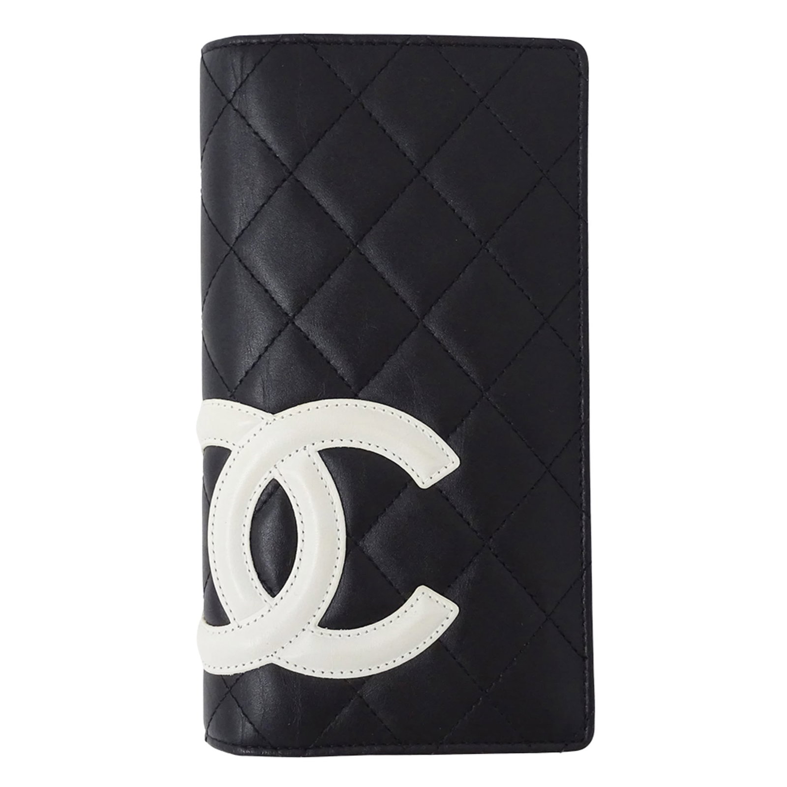 Chanel Long Wallet (Bi-Fold) Leather: Chanel Long Wallet (Bi-Fold) Leather Chanel's iconic bi-fold design in sleek black lambskin leather. This long wallet features classic Chanel style with clean lines and minimal ornamentation, making