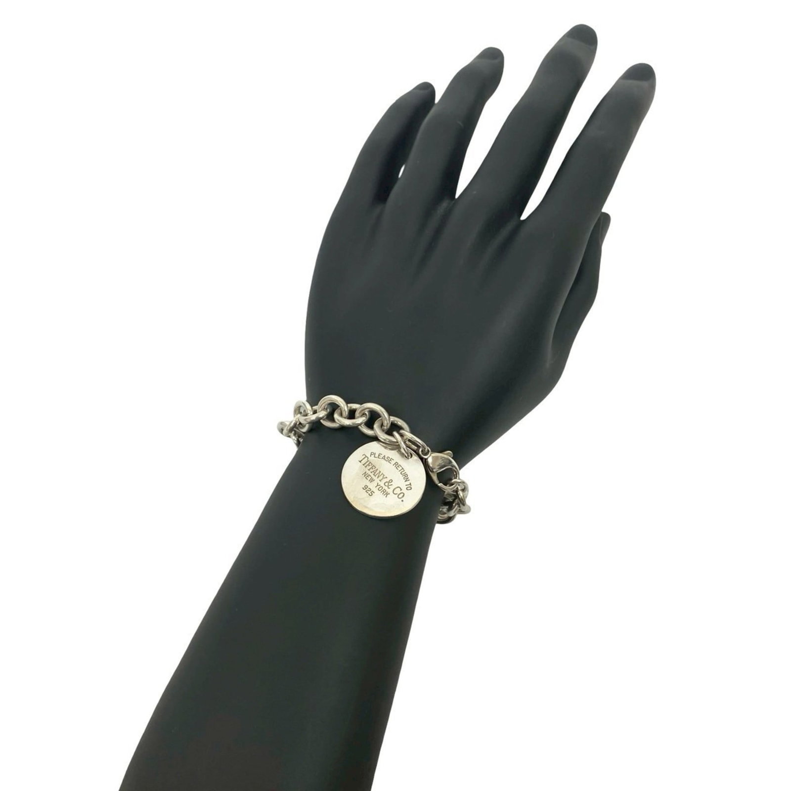 Tiffany Charm Bracelet Silver 925: Tiffany Charm Bracelet Silver 925 Silver 925 Tiffany Charm Bracelet with Traces of Usage. This used charm bracelet features silver 925 material and has visible scratches/dirt from previous use. Its